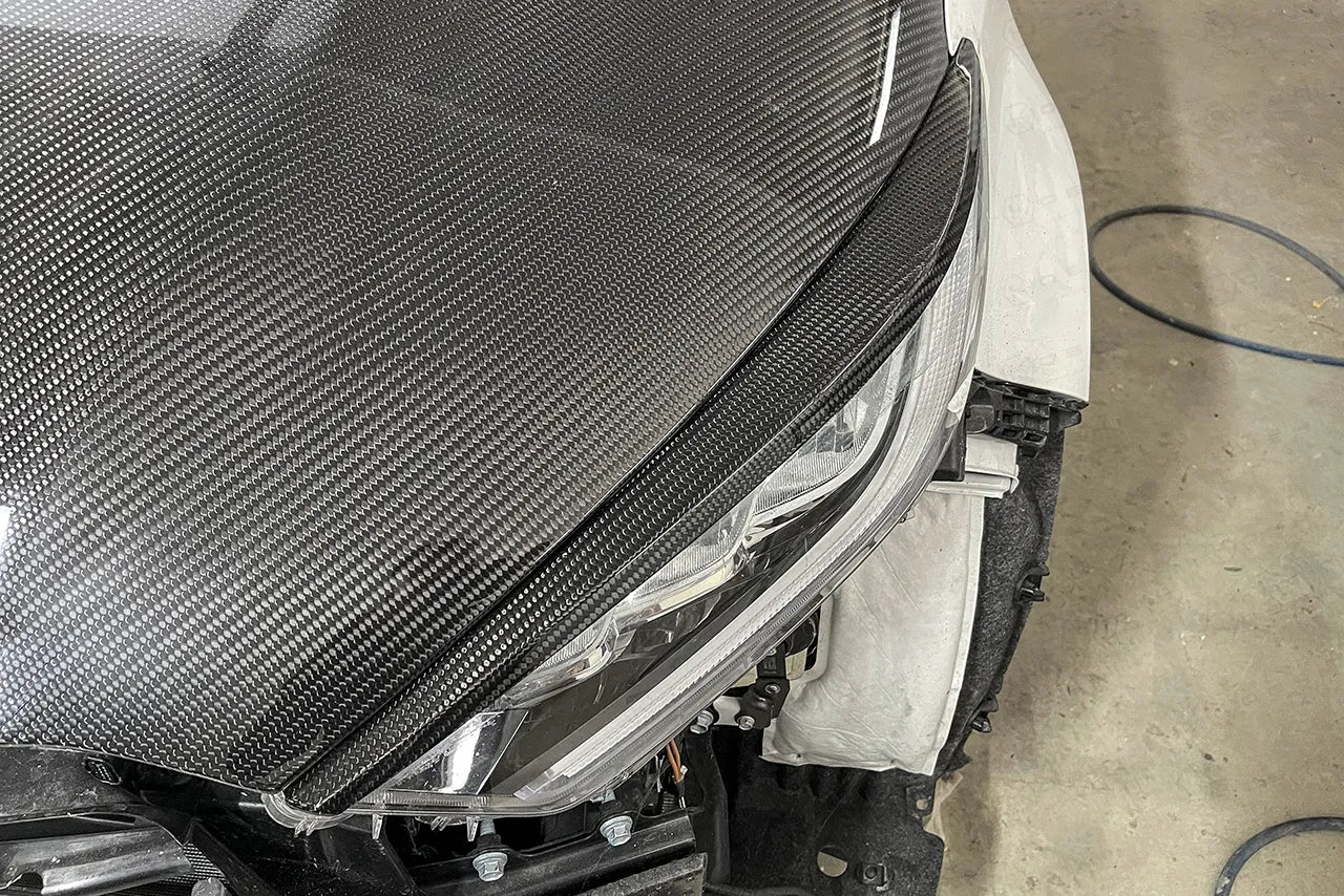 Toyota GR Yaris Headlights Cover (Angry Look) - Carbon Fibre - Ghost Developments